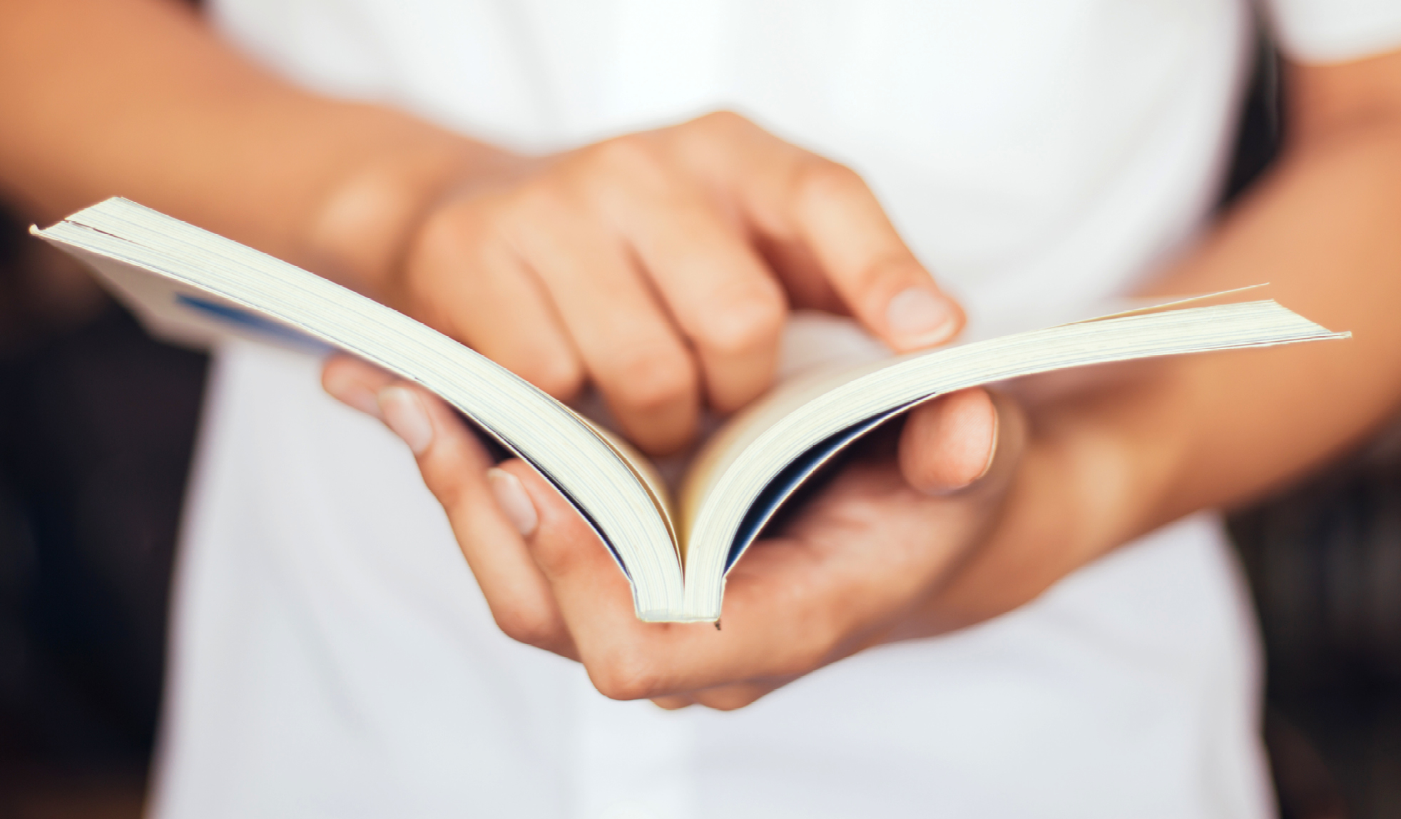 Hands holding book 