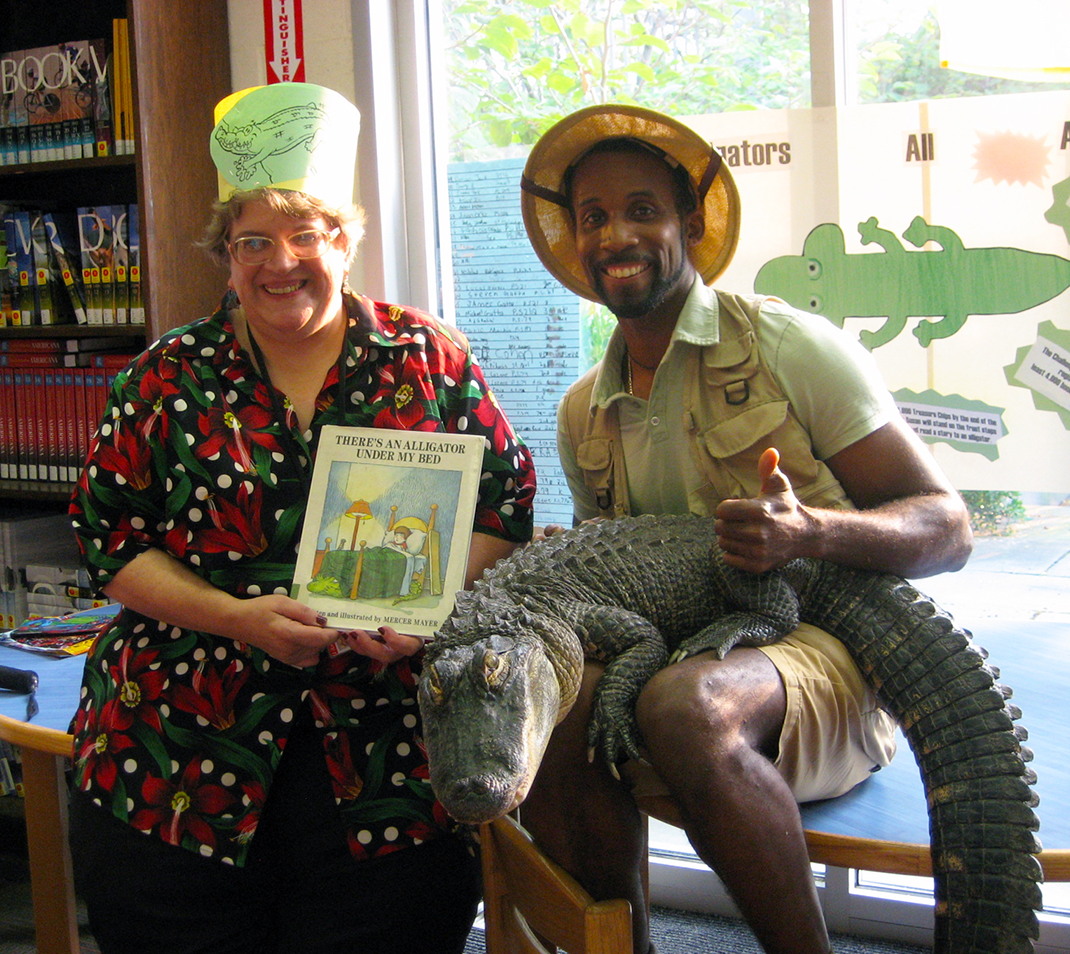 Susan Scatena with Erik "The Reptile Guy" Callender in 2013.