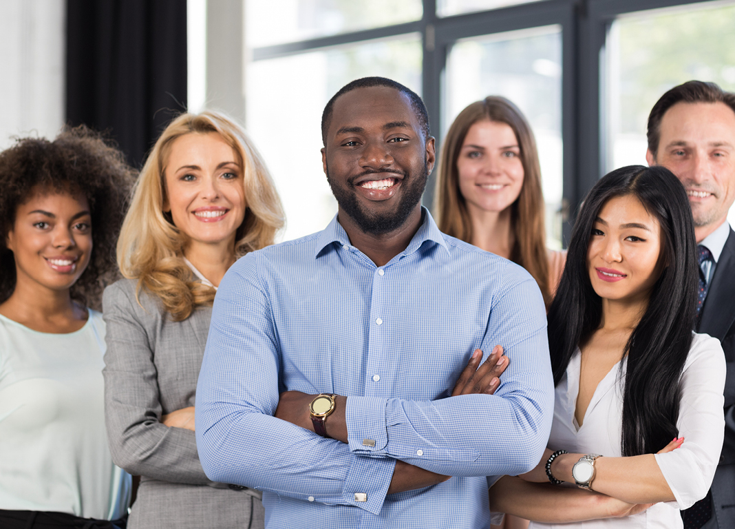 Diverse group of people gathered in office 