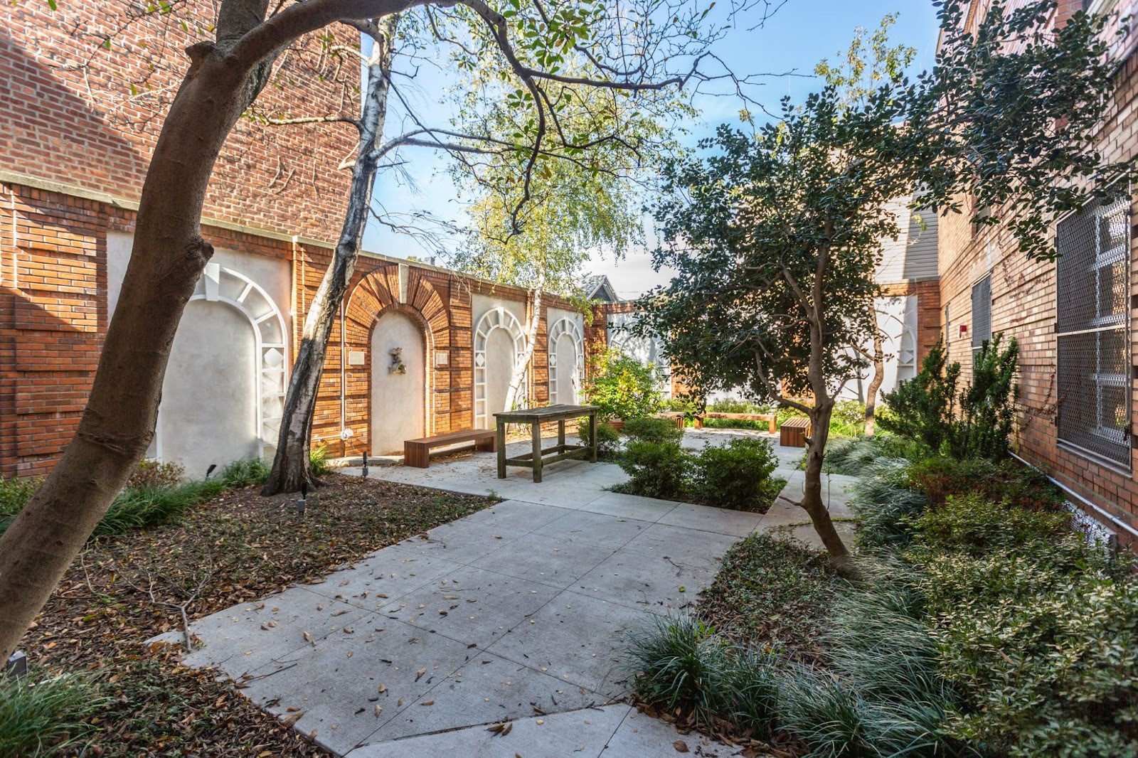 The rear garden at Glendale Library was rehabilitated and features new plantings and restored brickwork along the walls.